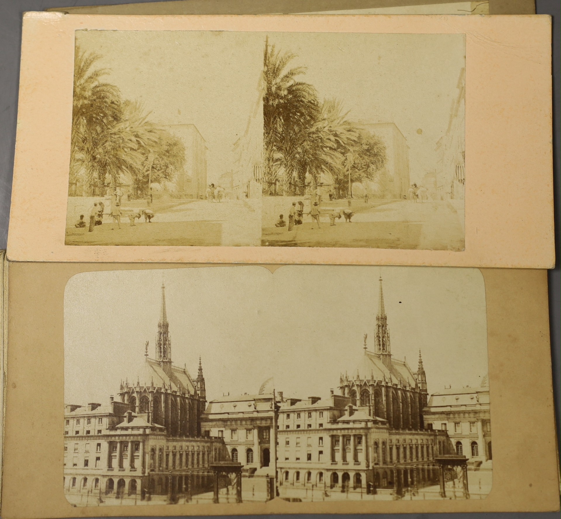 A Victorian walnut stereoscopic viewer and a quantity of slides